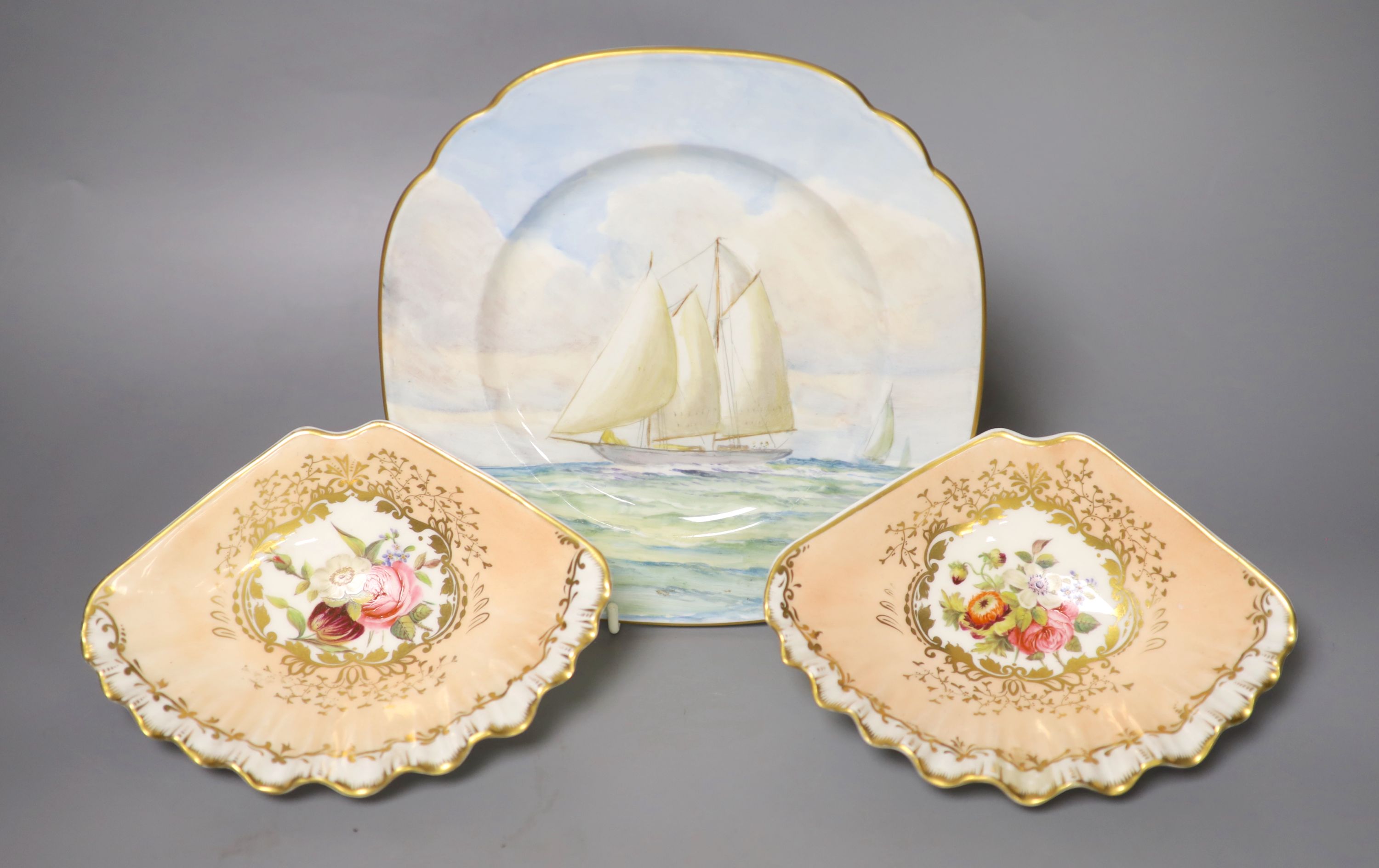 A Royal Crown Derby square shaped plate, painted with a yachting scene by WEJ Dean, and pair of Crown Derby scallop dishes